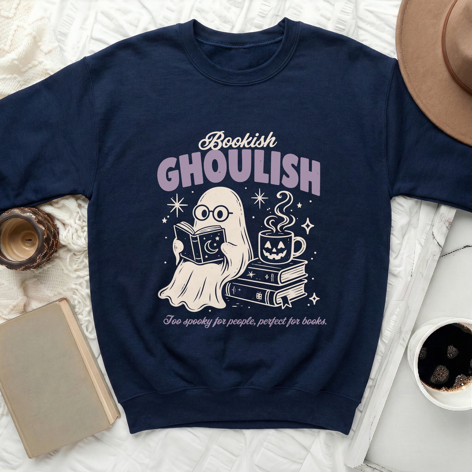 Navy sweatshirt with ghost reading and drinking coffee, text "Bookish GHOULISH".