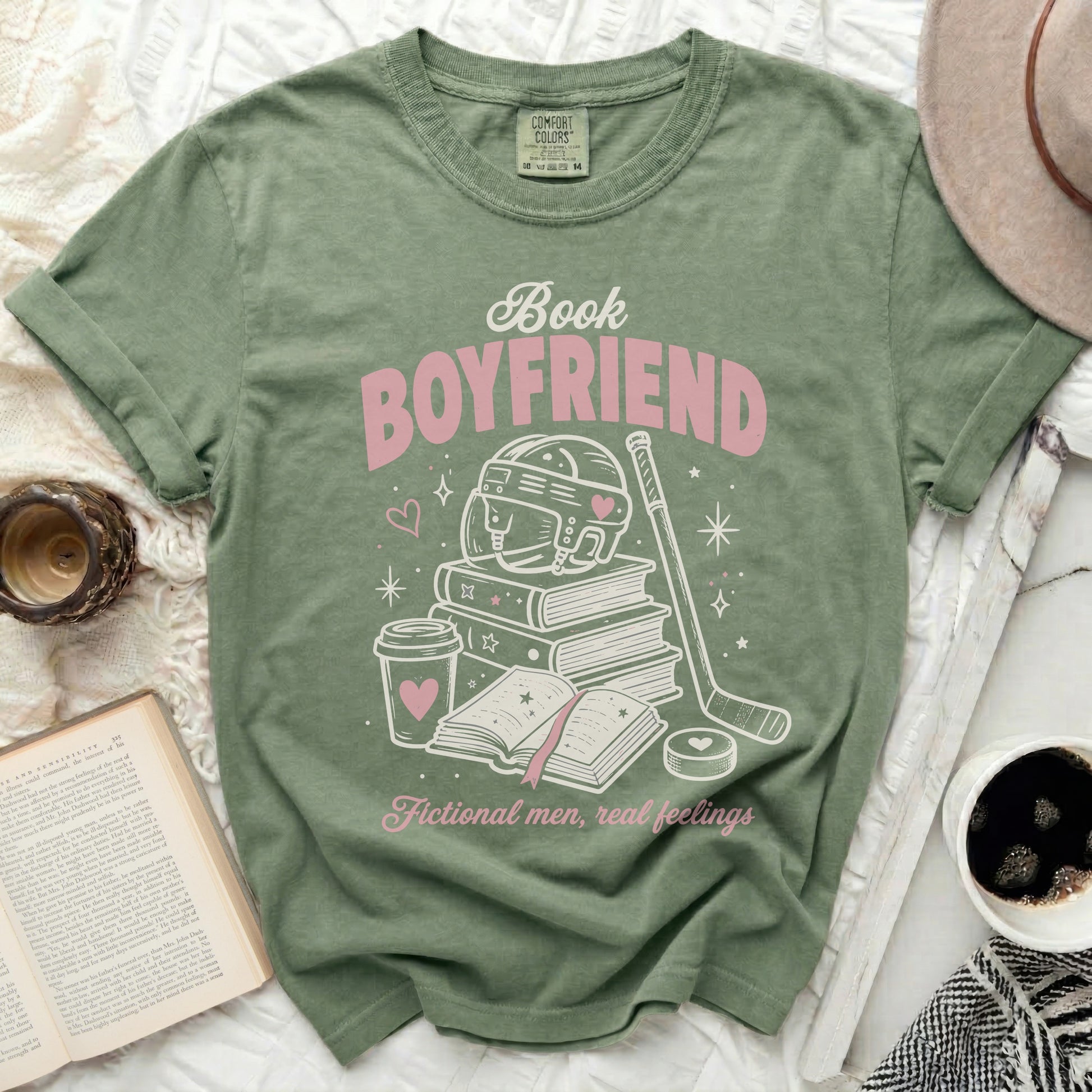 Green t-shirt with "Book Boyfriend" design featuring books, hockey, and hearts.