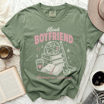 Green t-shirt with "Book Boyfriend" design featuring books, hockey, and hearts.