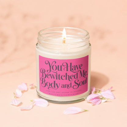 Jar candle with pink label reading "You Have Bewitched Me Body and Soul" and "MagicMerchEmporium".