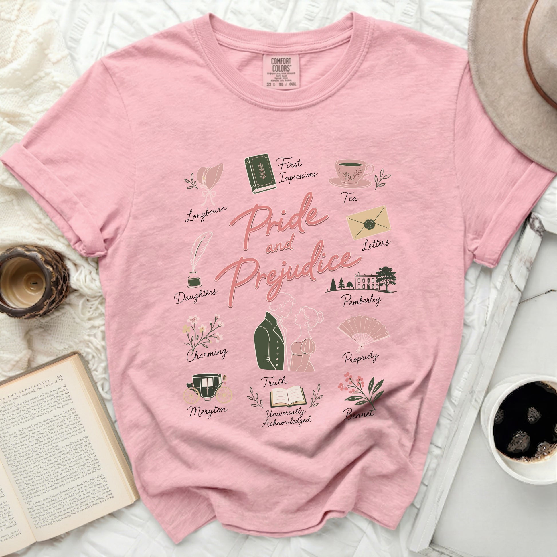 Pink t-shirt with "Pride and Prejudice" design and literary icons.
