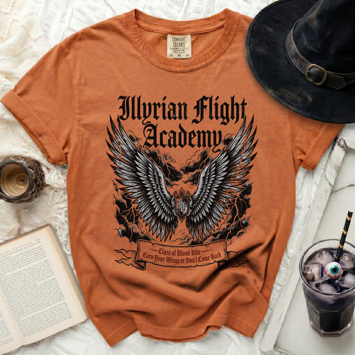 Orange t-shirt with "Illyrian Flight Academy" and winged shield graphic.