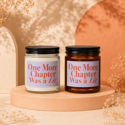 Two candles with "One More Chapter Was a Lie" text on light purple labels.