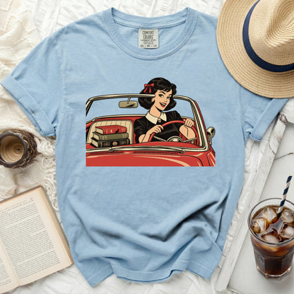 Light blue Comfort Colors t-shirt with graphic of a woman in a red car.