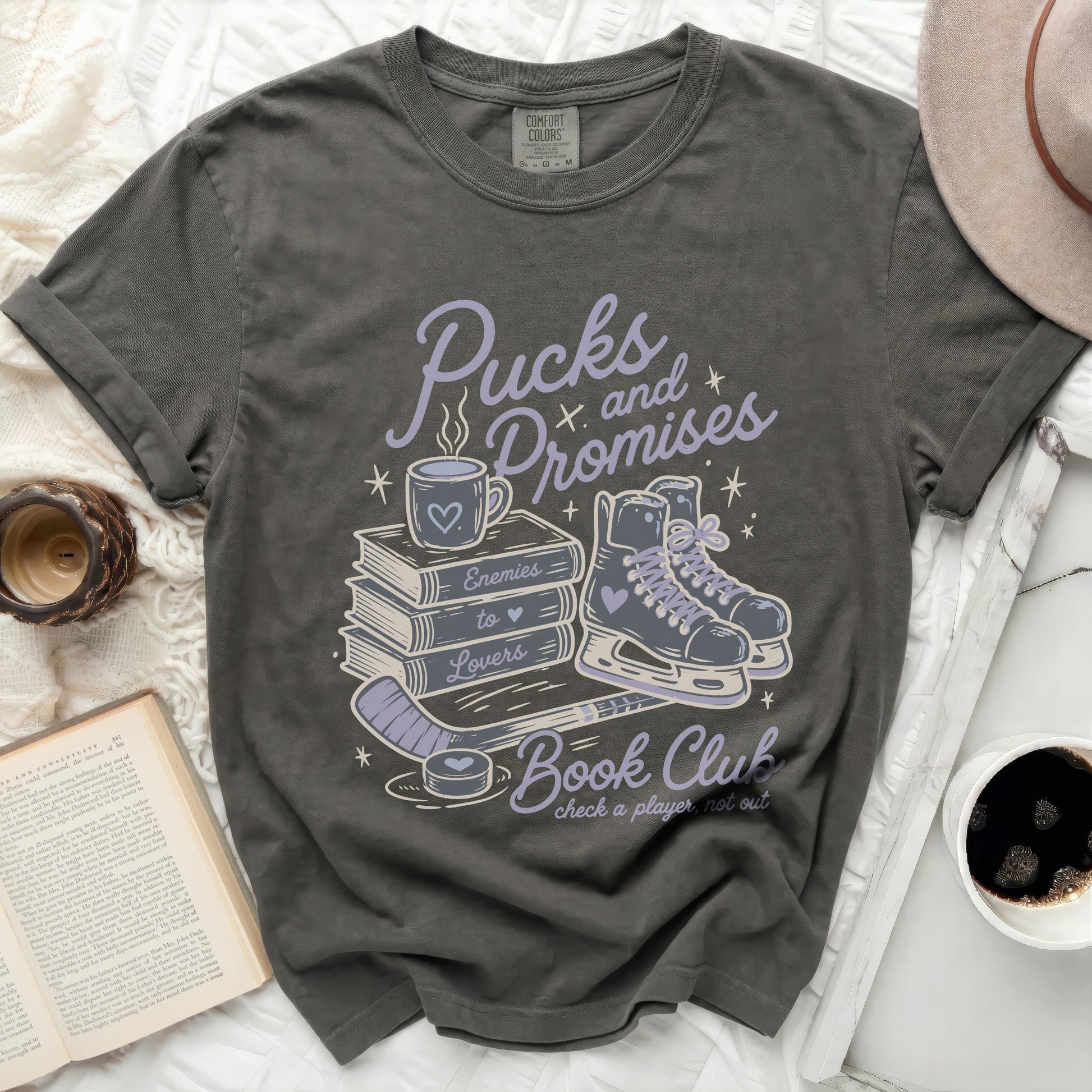 Dark gray t-shirt with "Pucks and Promises Book Club" text and graphic.