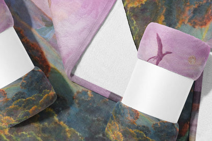 Blanket with a watercolor print of a dinosaur flying through a galaxy.