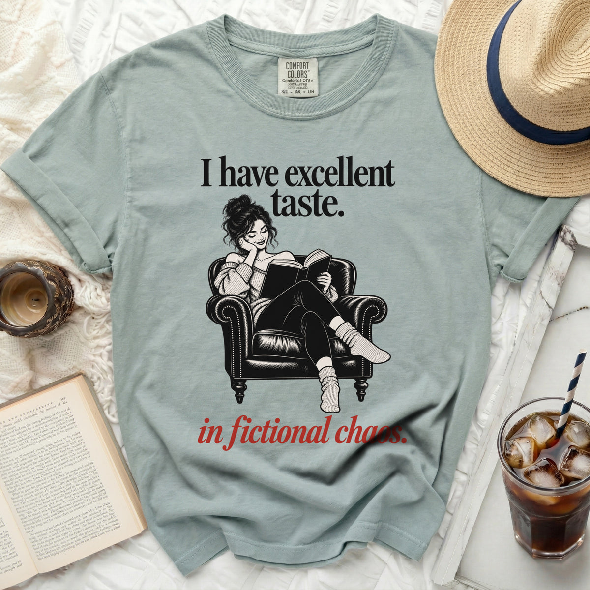 "I have excellent taste." t-shirt with a woman reading in a chair.