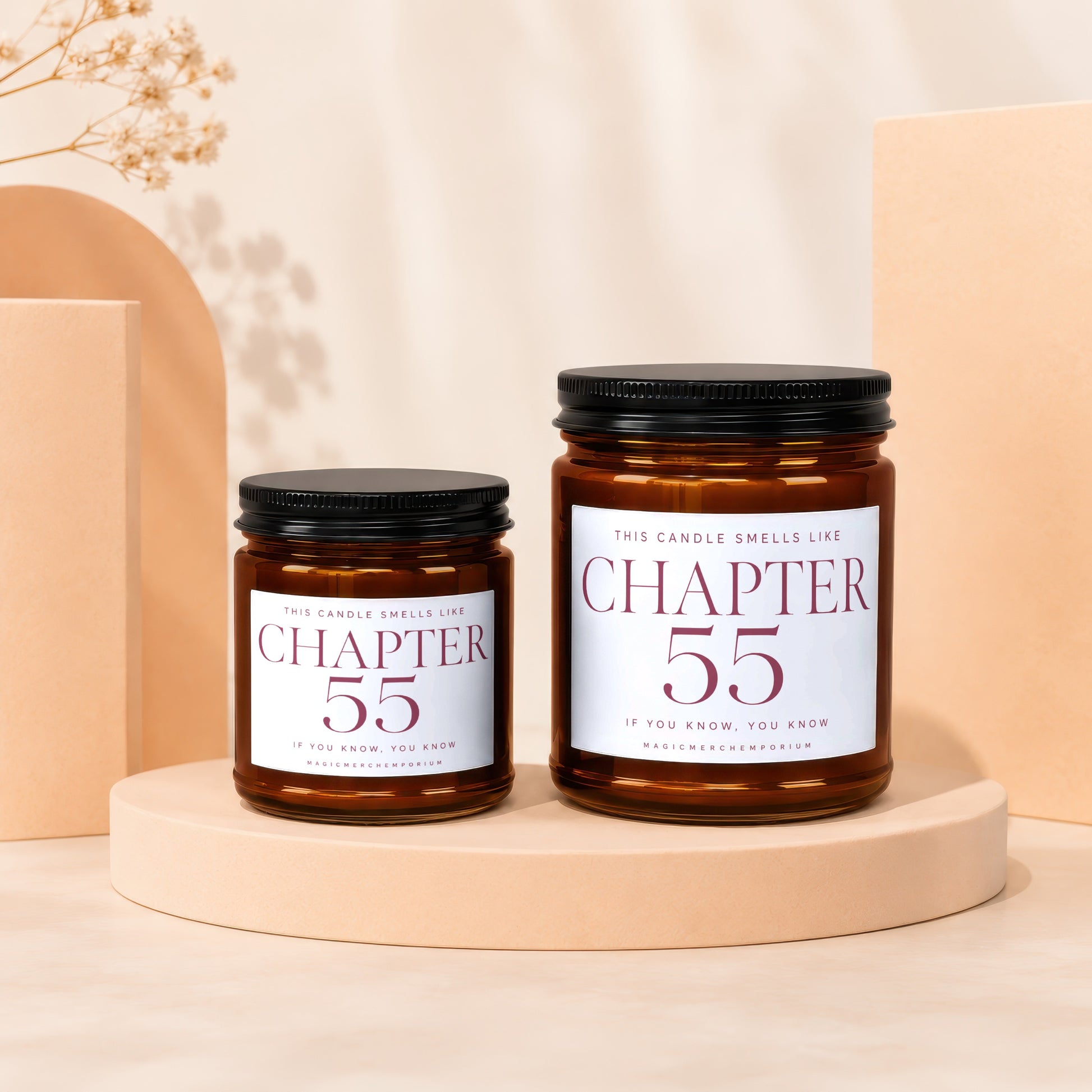 Two amber glass candles with black lids display "Chapter 55" labels.