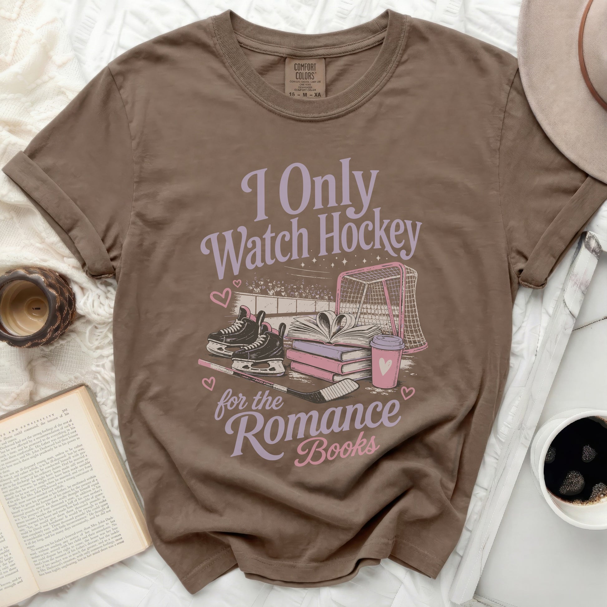 Brown t-shirt with "I Only Watch Hockey for the Romance Books" graphic.