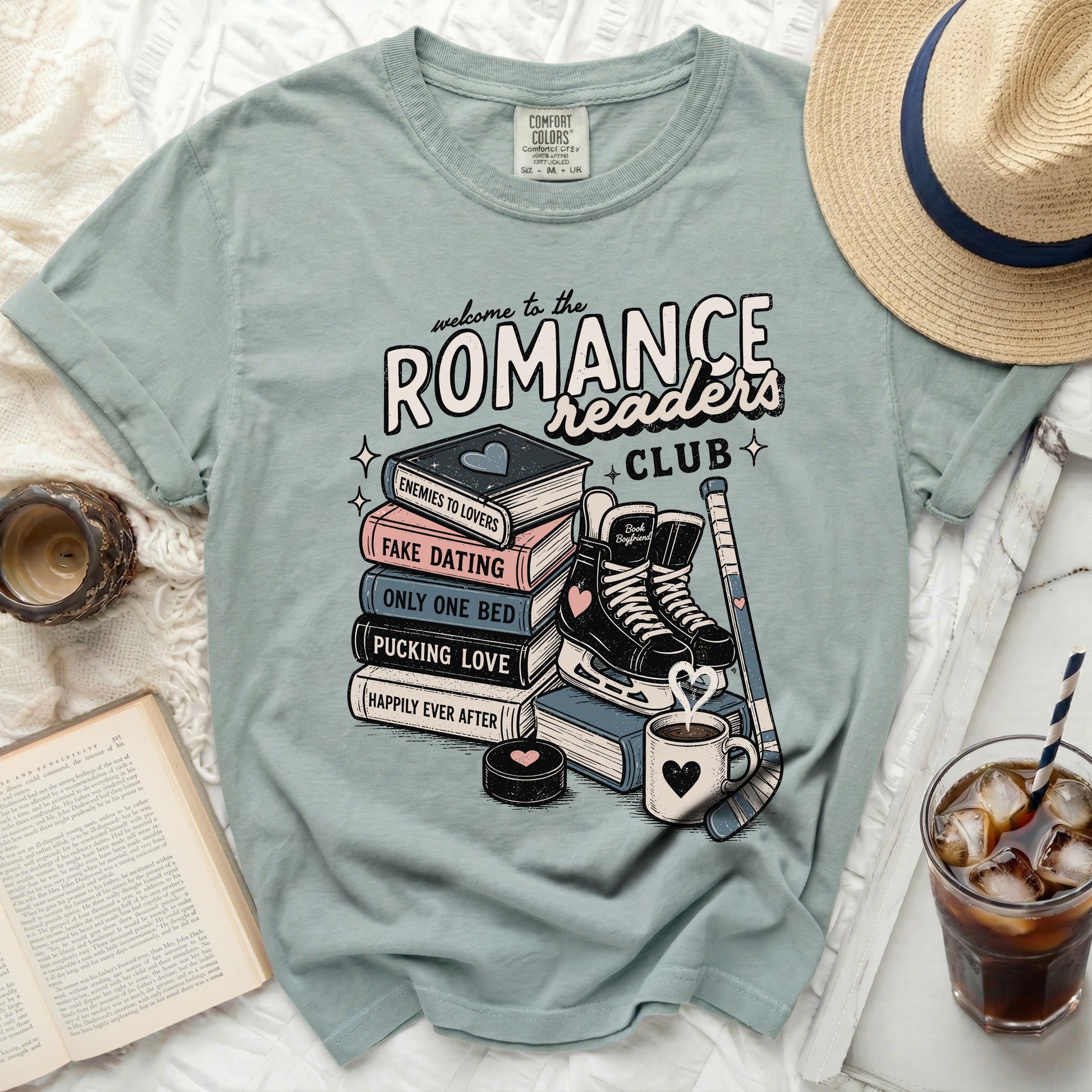 Romance Readers Club graphic tee with books, skates, hockey stick, and text.