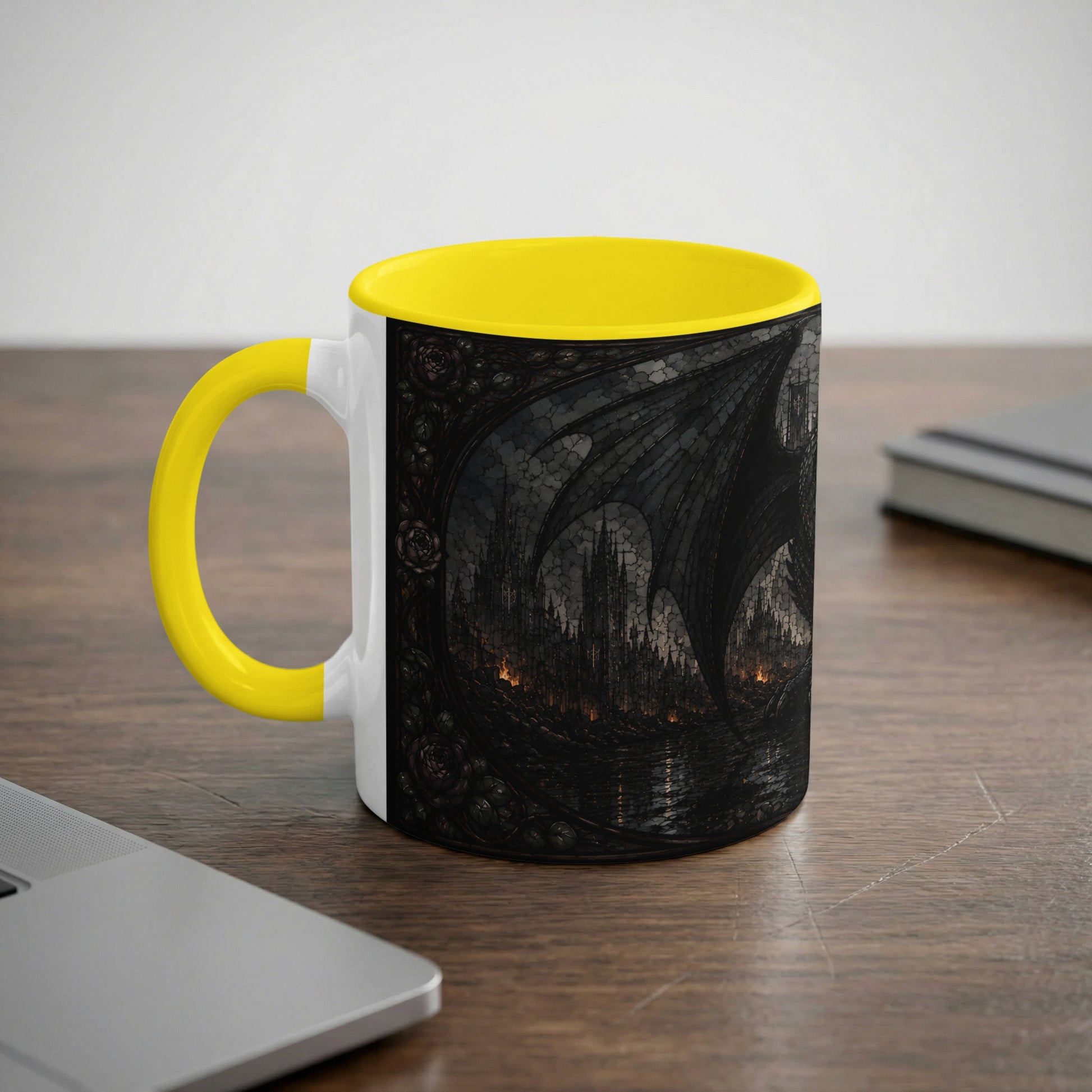 White mug with yellow handle, featuring a dark fantasy dragon wing and castle scene.