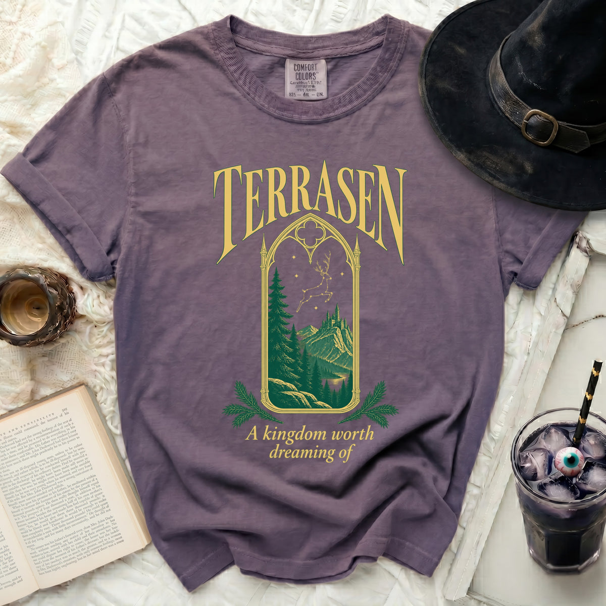 Purple t-shirt with "TERRASEN" text and a forest castle scene.