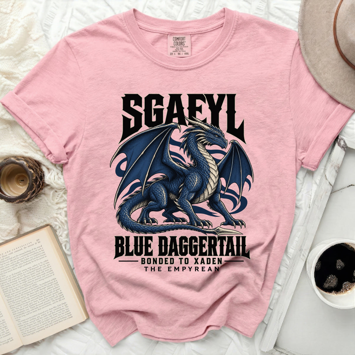 Pink t-shirt with a blue dragon graphic and the text SGAEYL, BLUE DAGGERTAIL, BONDED TO XADEN, THE EMPYREAN.