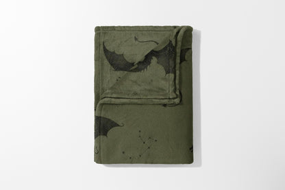 Olive green fleece throw blanket with black dragon and constellation print.