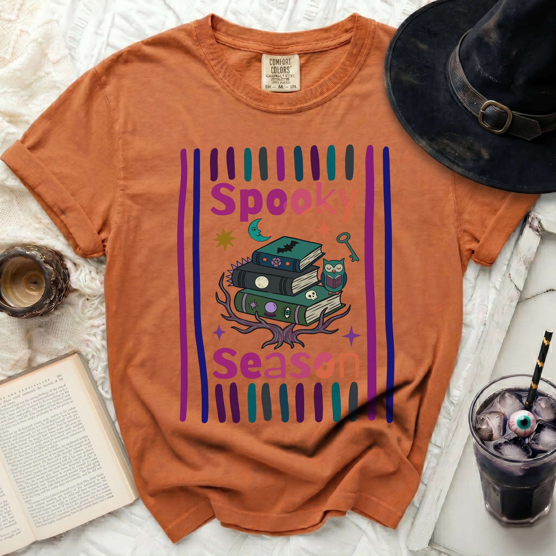 Orange t-shirt with "Spooky Season" text and Halloween illustrations.