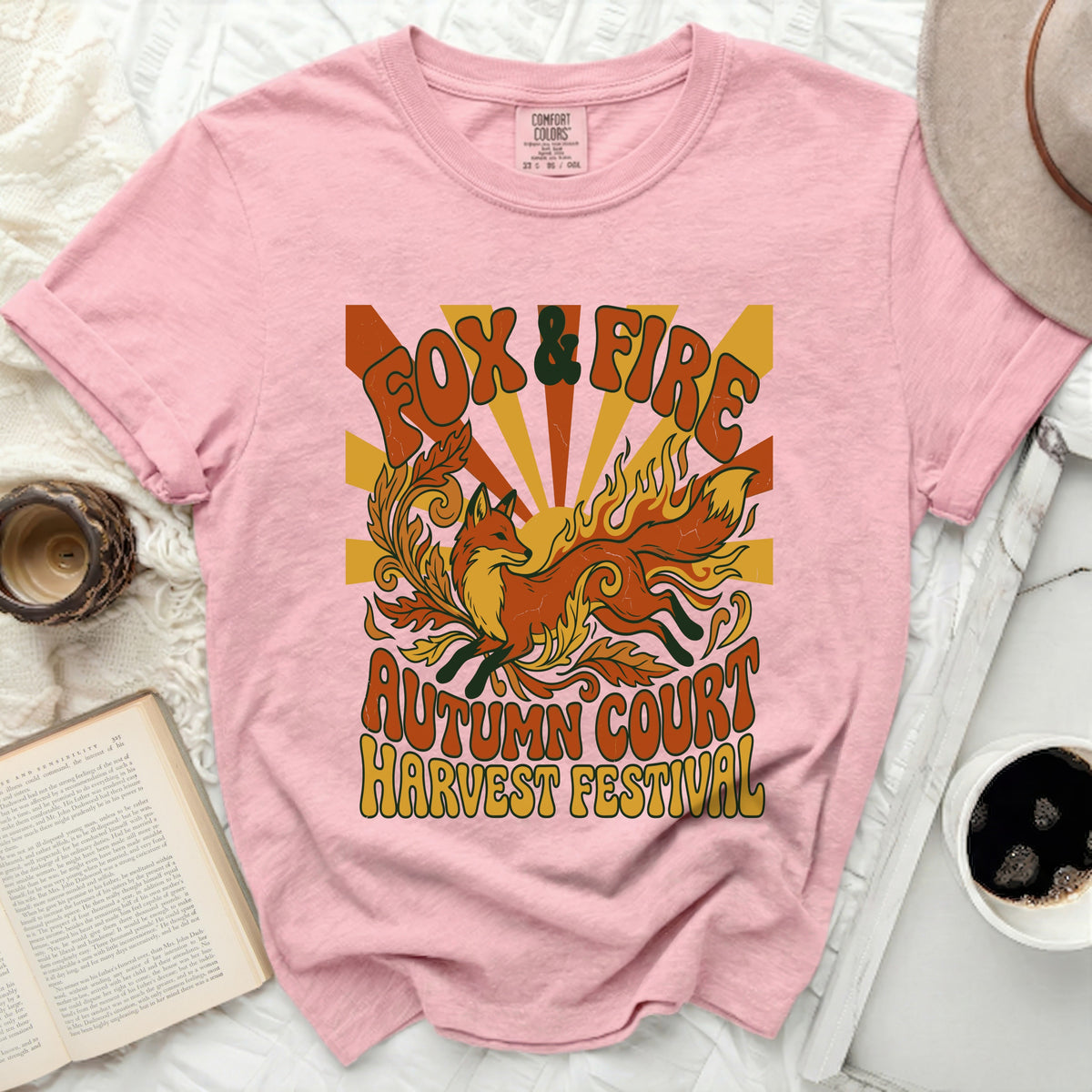 Pink t-shirt with "Fox & Fire Autumn Court Harvest Festival" graphic.