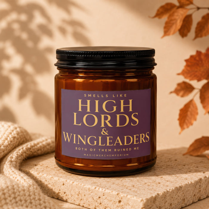 Amber candle in glass jar with purple label reading "Smells Like High Lords & Wingleaders".