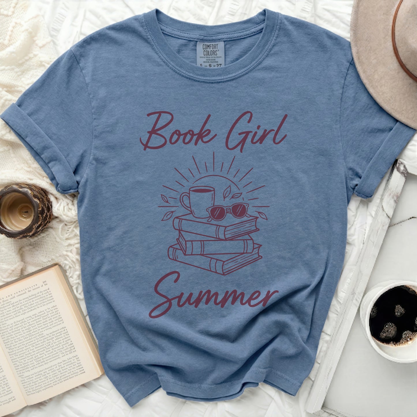Blue Comfort Colors t-shirt with "Book Girl Summer" graphic.