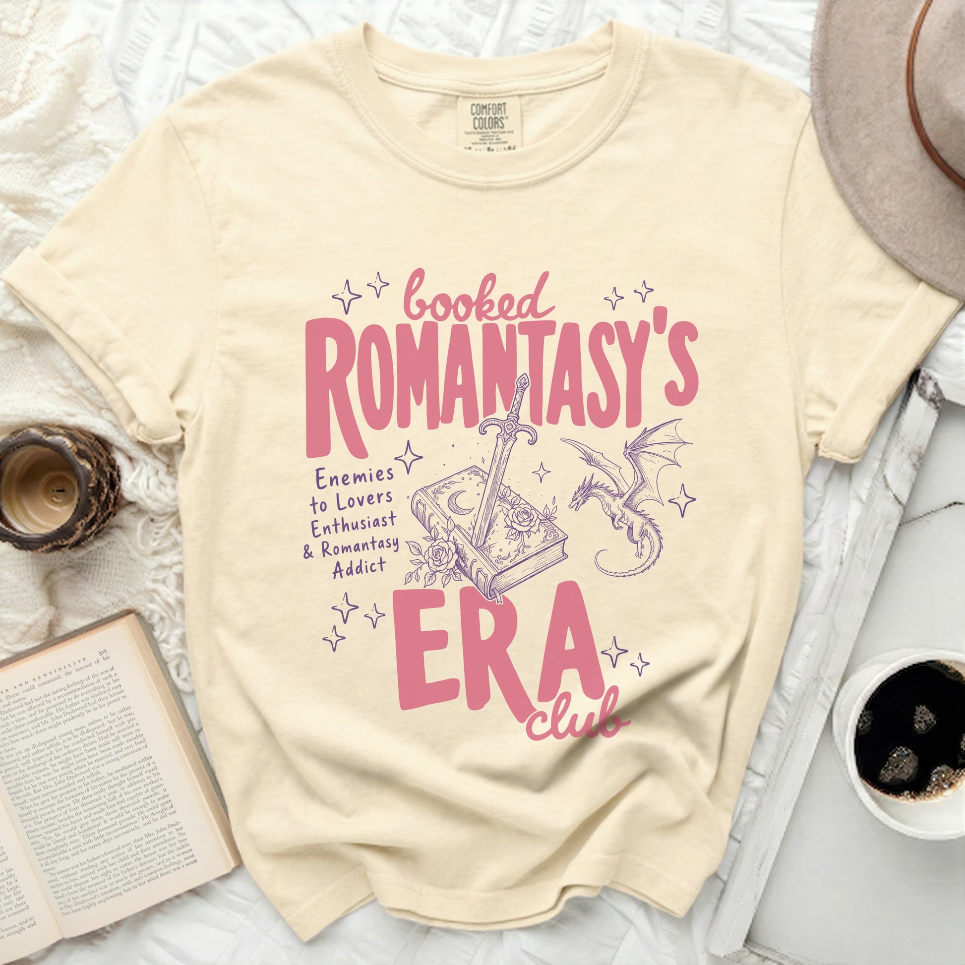 Booked Romantasy's Era Club t-shirt with sword, book, and dragon design.