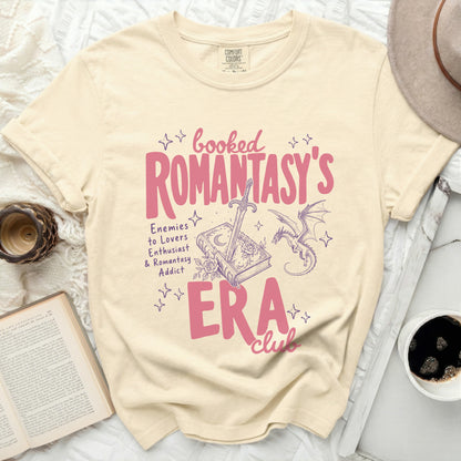 Booked Romantasy's Era Club t-shirt with sword, book, and dragon design.