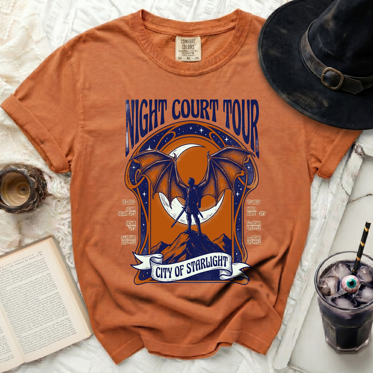 Orange t-shirt with "Night Court Tour City of Starlight" graphic.