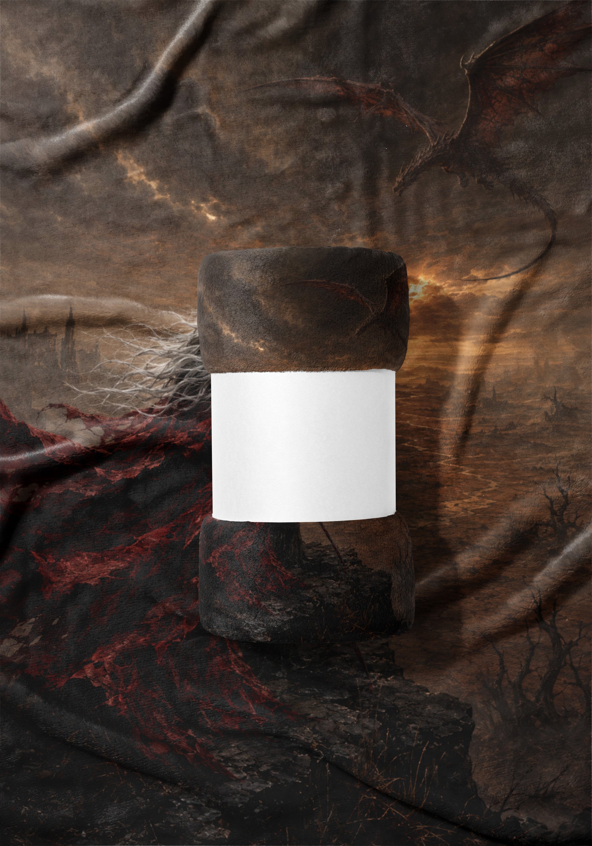 Rolled blanket with white band, featuring a dragon in a dark, cloudy landscape.