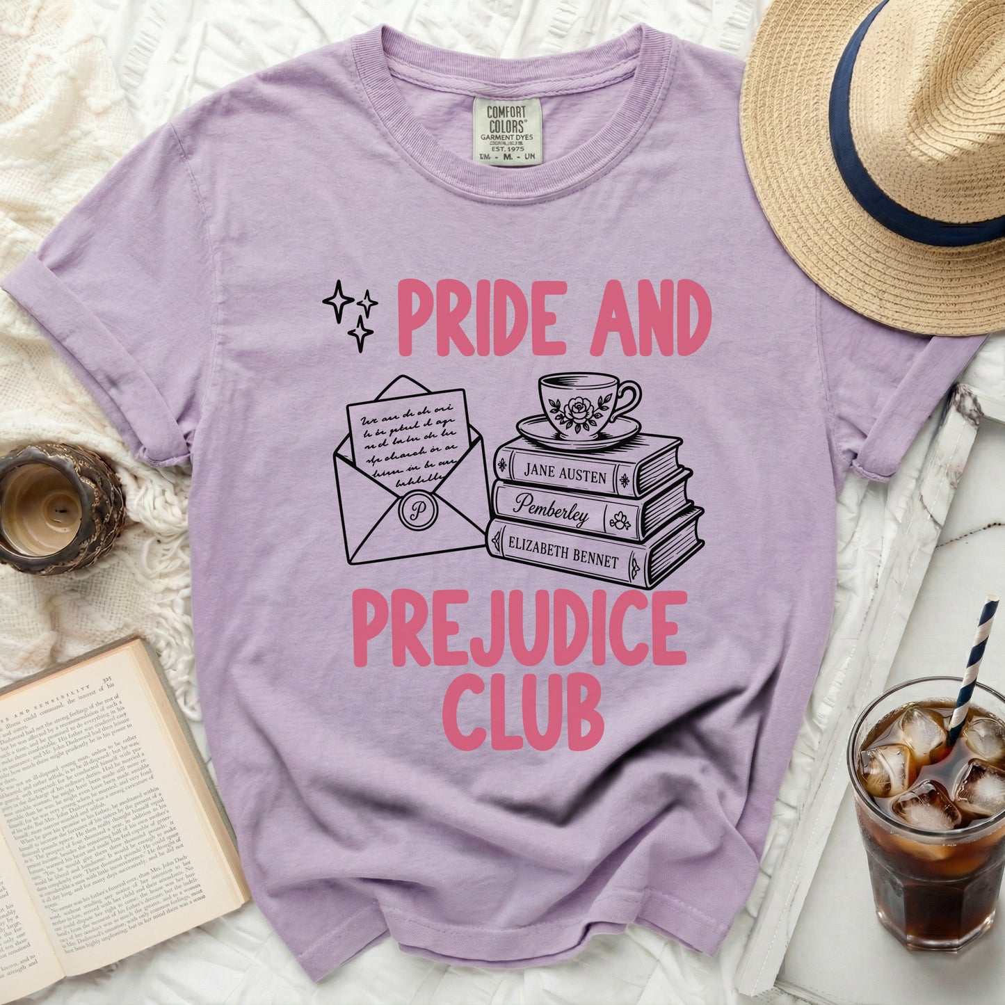 Purple t-shirt with "Pride and Prejudice Club" text and book graphic.