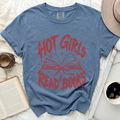 Blue t-shirt with red text and graphic of an open book.