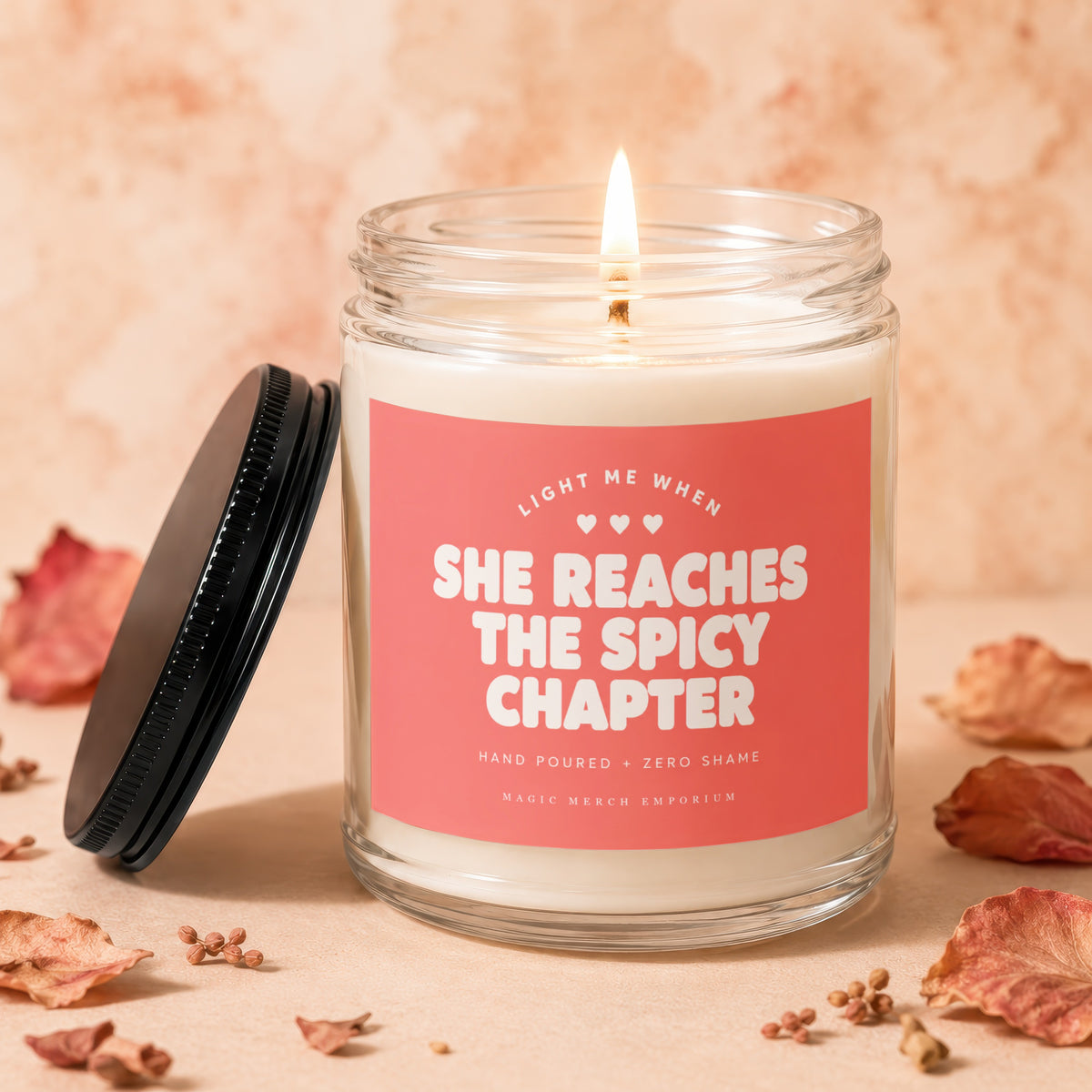 Candle with "She Reaches The Spicy Chapter" text and a lit wick.