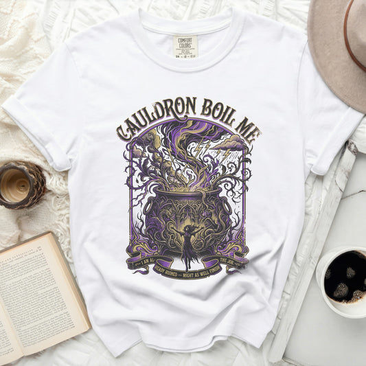 White t-shirt with "Cauldron Boil Me" and witch graphic.
