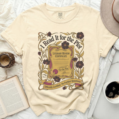 Cream t-shirt with "I Read It for the Plot" literary certificate design.
