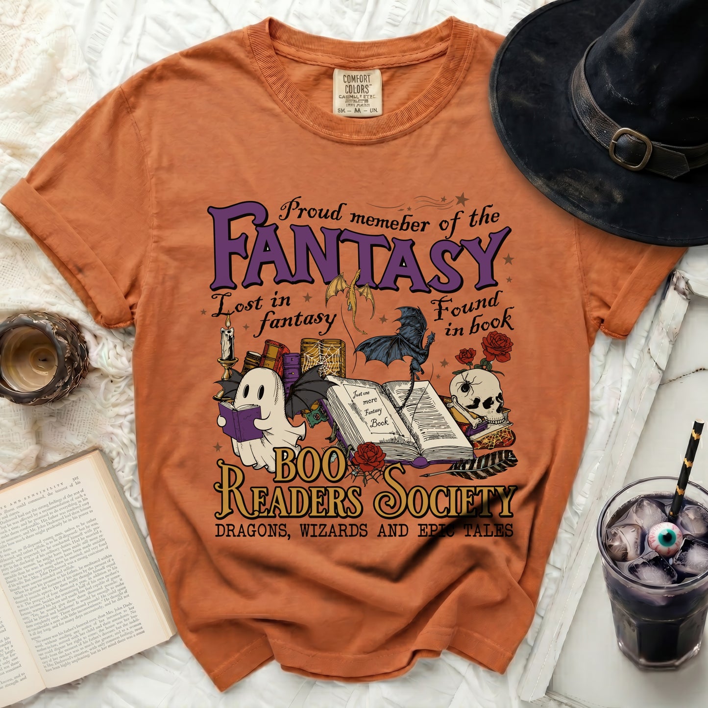 Orange t-shirt with "Fantasy Boo Readers Society" text and spooky illustrations.