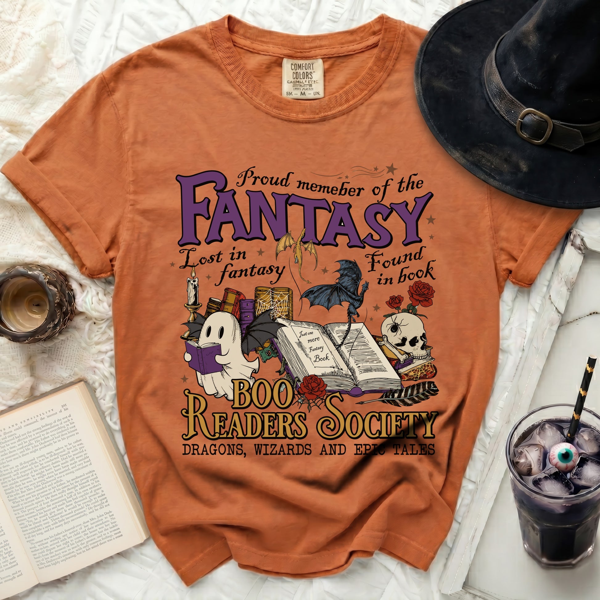 Orange t-shirt with "Fantasy Boo Readers Society" text and spooky illustrations.