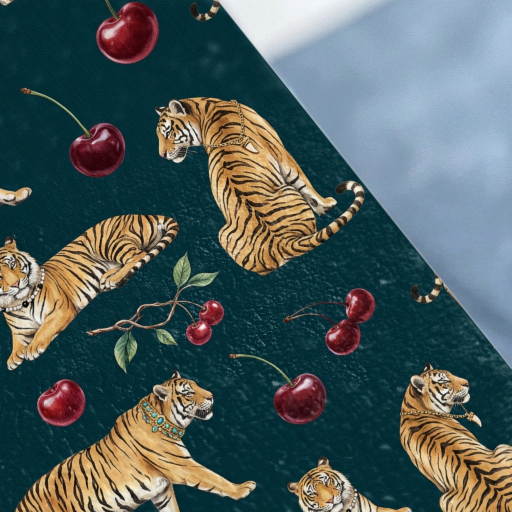 Tigers and cherries pattern on a dark teal background.