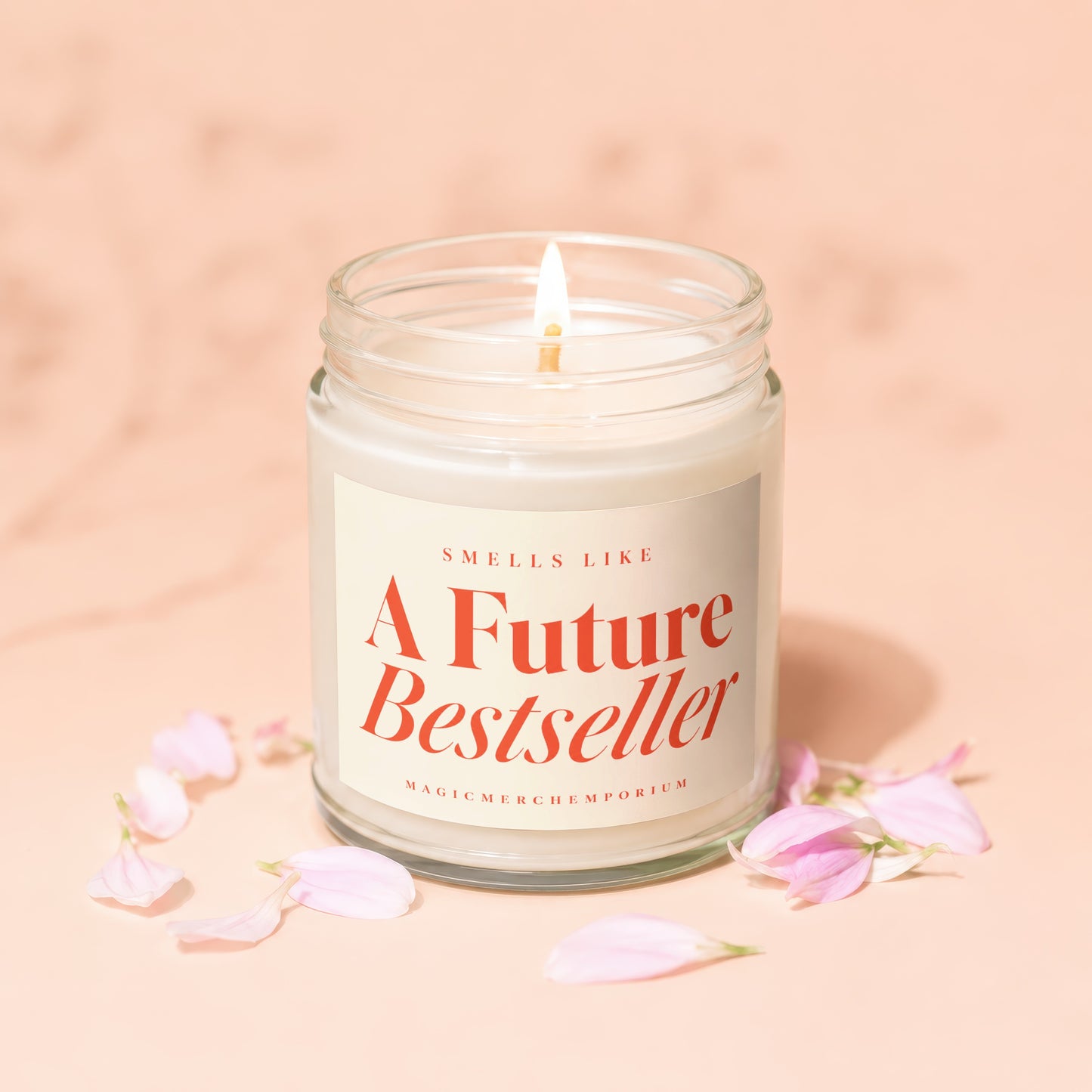 Candle with lit wick, "Smells Like A Future Bestseller" text in red.