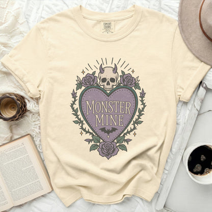 Cream t-shirt with purple heart graphic and "MONSTER MINE" text.