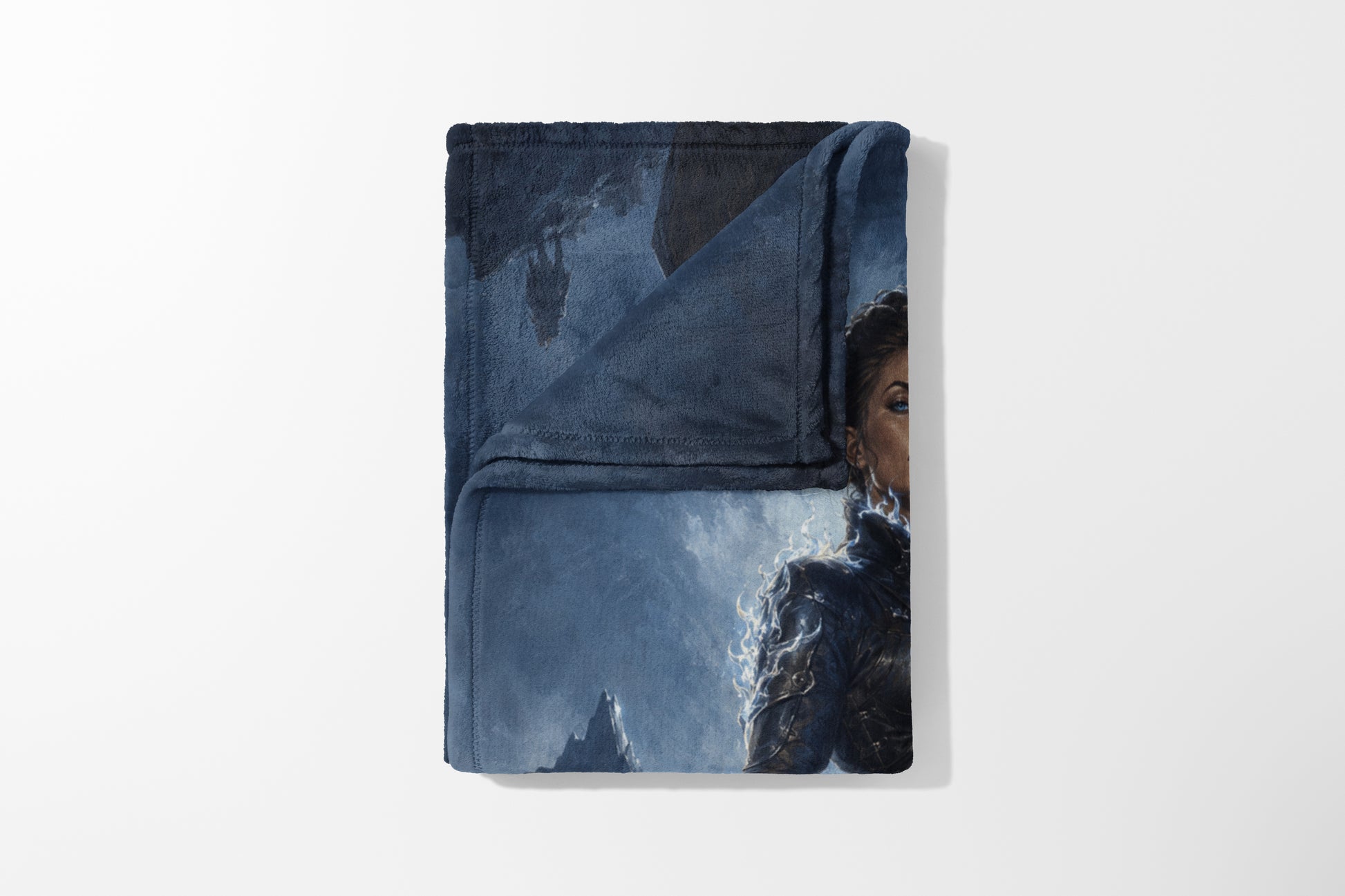 Fleece blanket with a fantasy warrior woman and rocky landscape illustration.