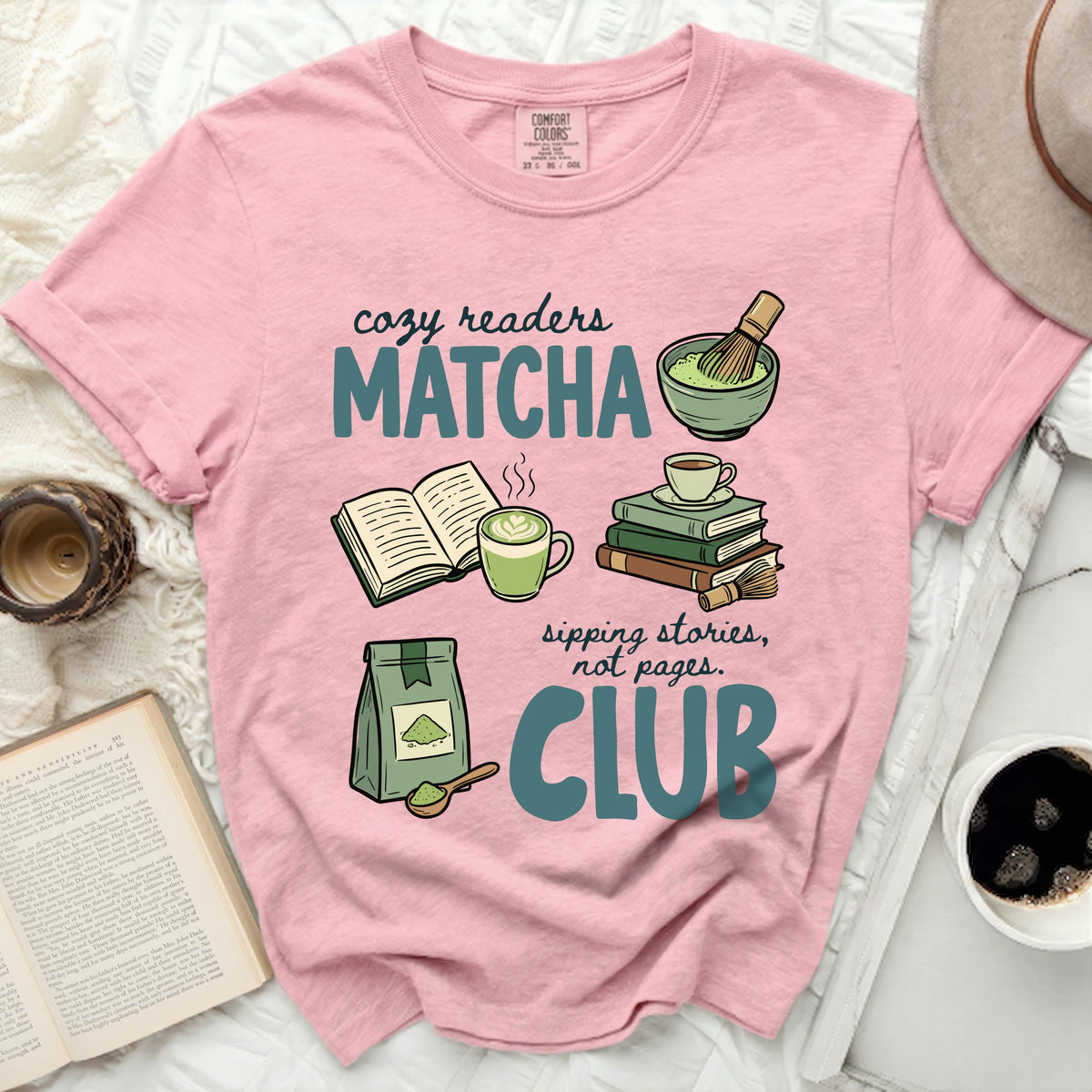 Pink t-shirt with "cozy readers Matcha sipping stories, not pages. CLUB" graphic.
