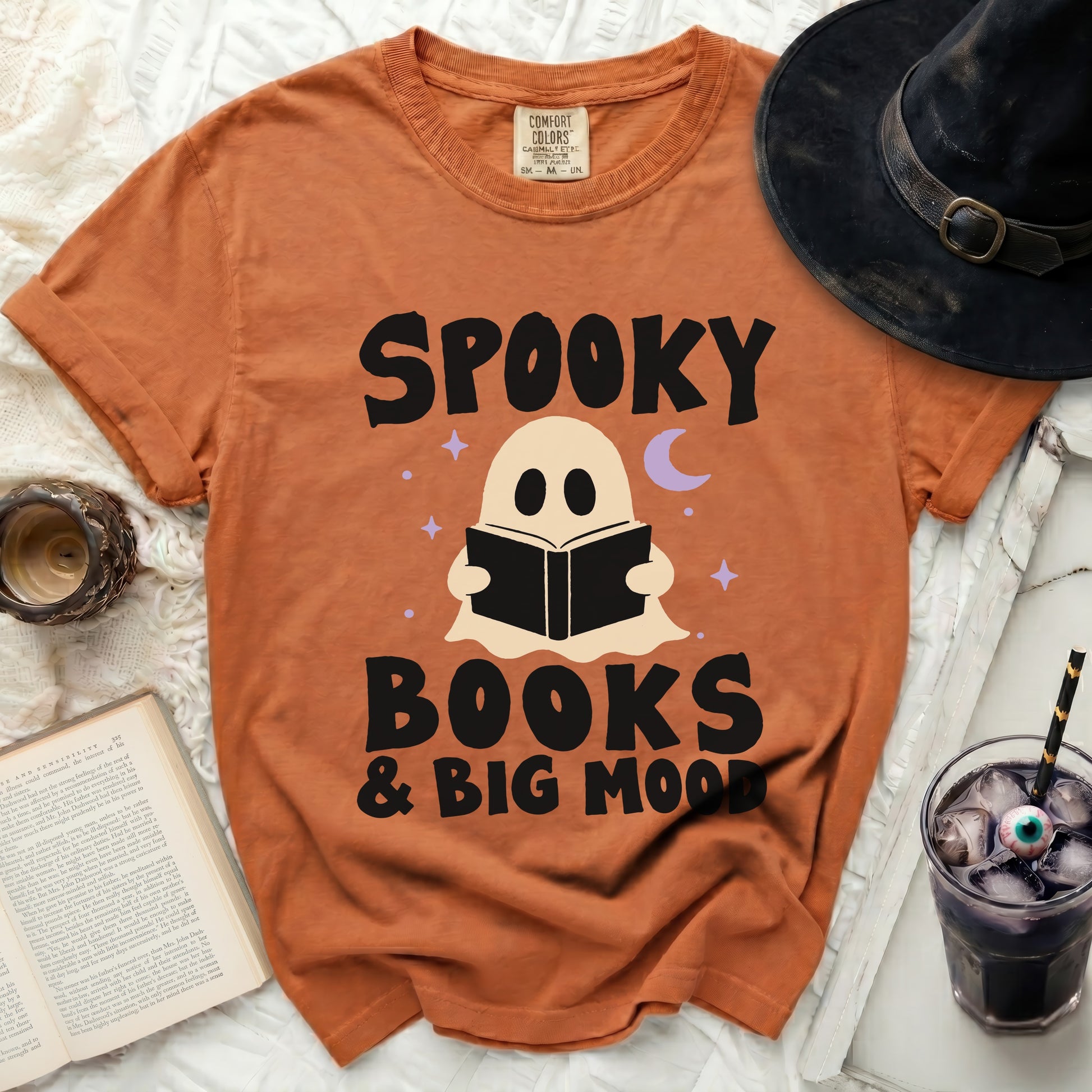Orange t-shirt with "Spooky Books & Big Mood" text and ghost graphic.