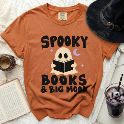 Orange t-shirt with "Spooky Books & Big Mood" text and ghost graphic.