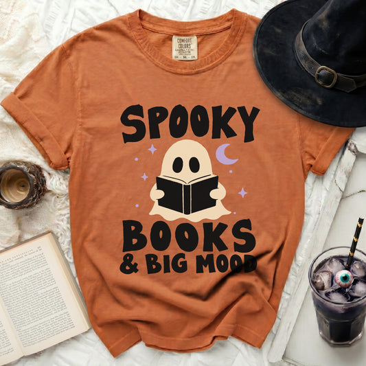 Orange t-shirt with "Spooky Books & Big Mood" text and ghost graphic.