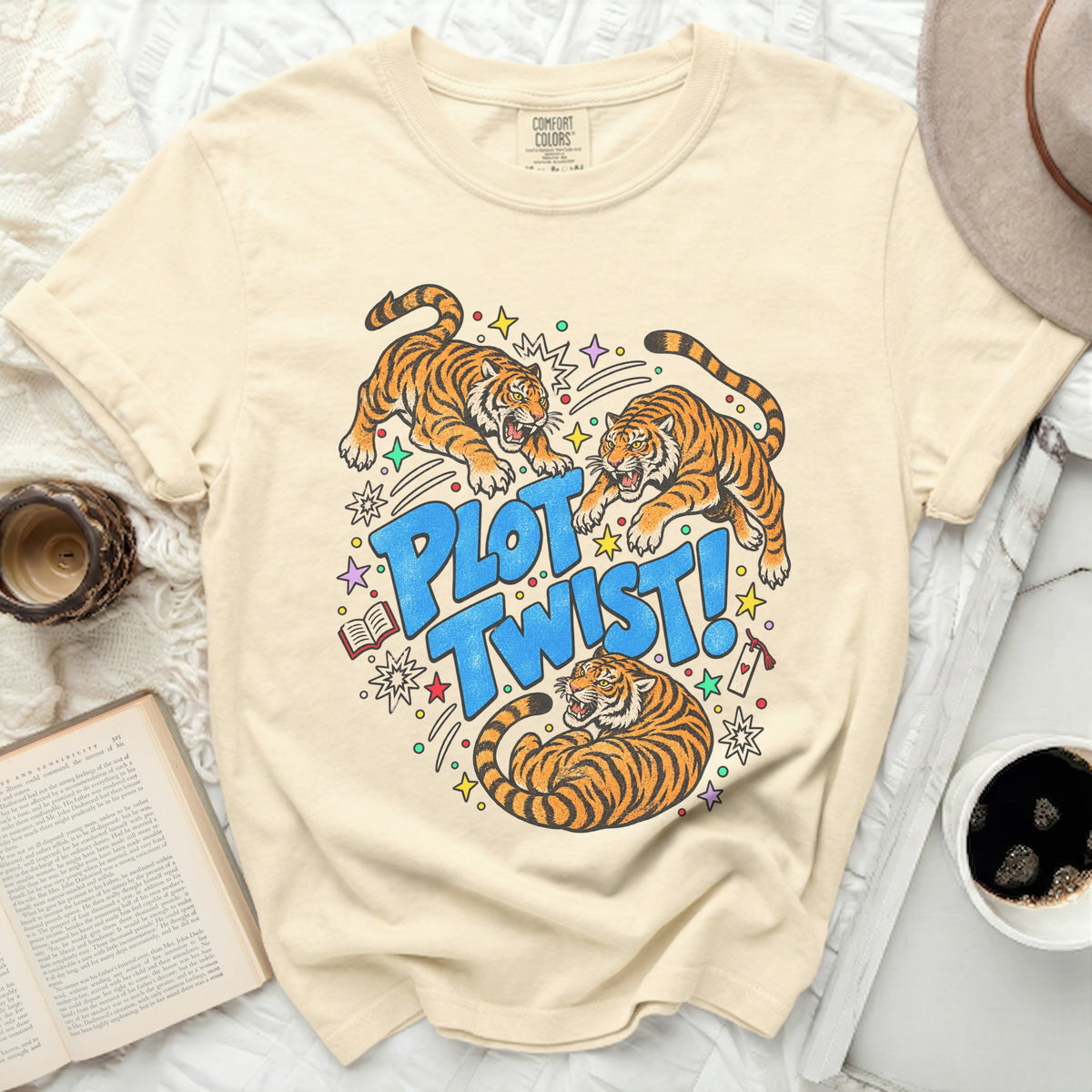 T-shirt with three tigers and "PLOT TWIST!" text in blue lettering.