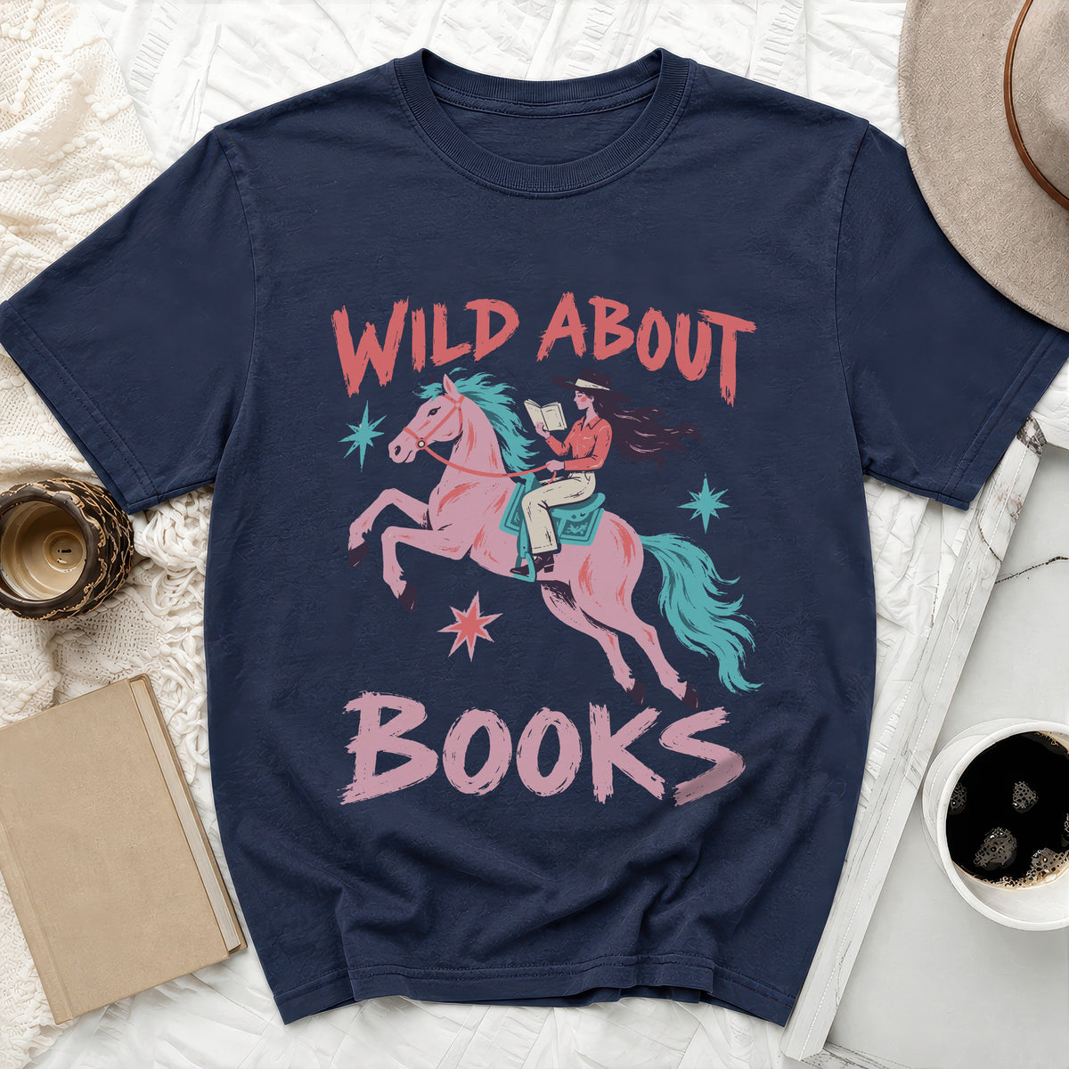 Navy t-shirt with illustration of woman riding horse and reading, text "Wild About Books".