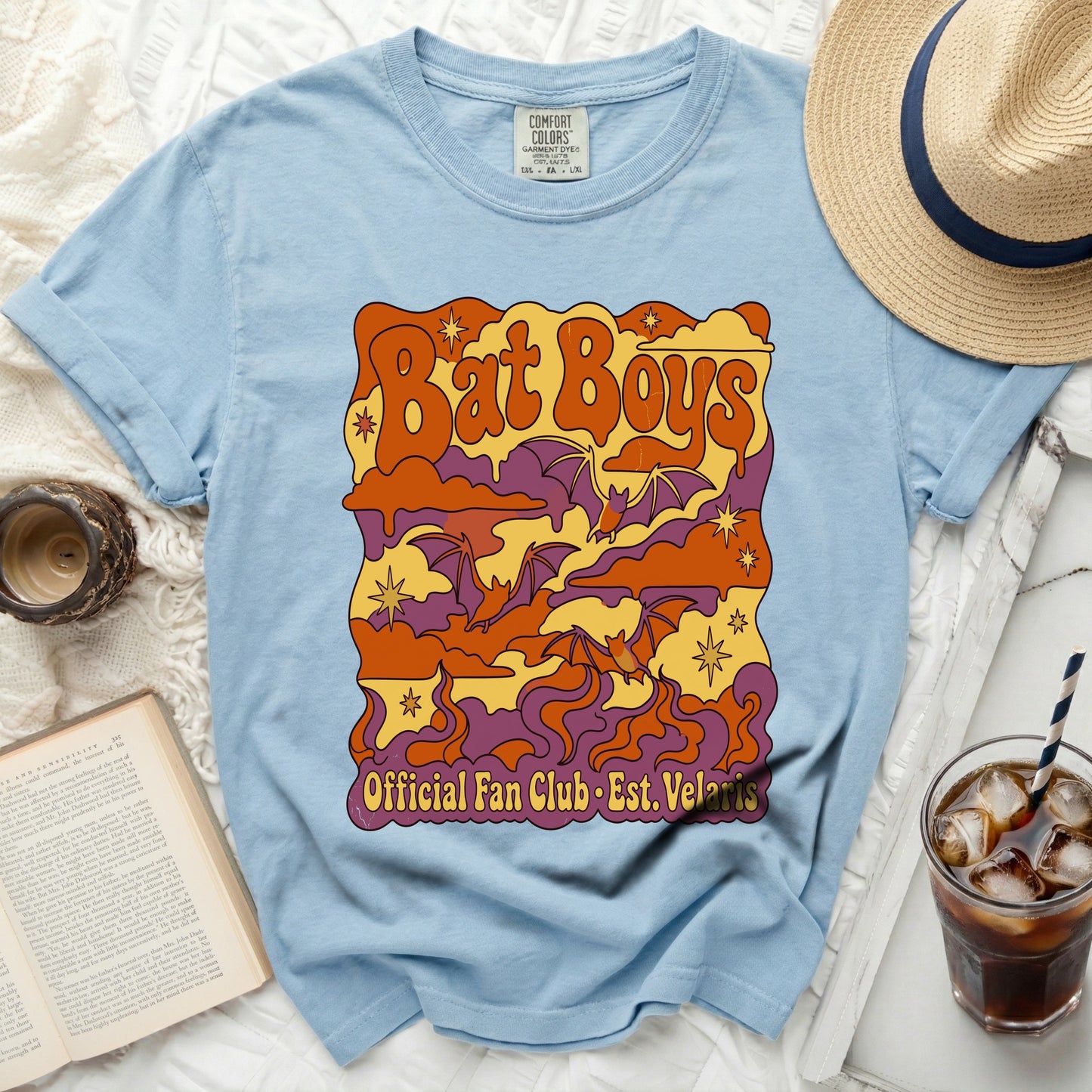 Light blue t-shirt with "Bat Boys Official Fan Club Est. Velaris" graphic.