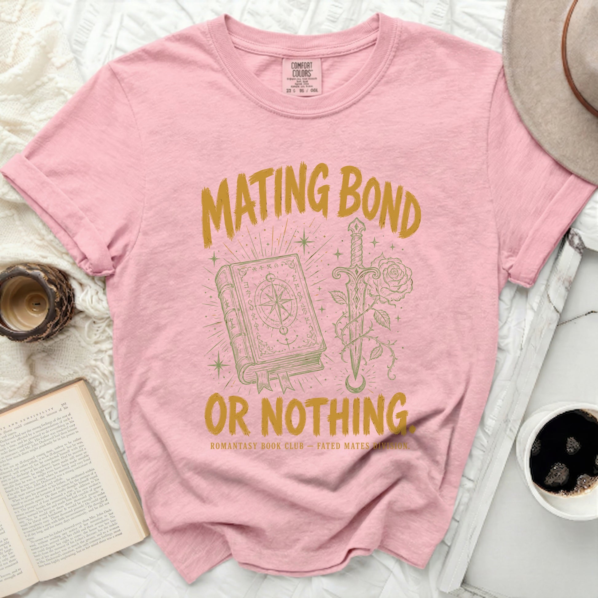 Pink t-shirt with "Mating Bond" text, open book, sword, and rose.