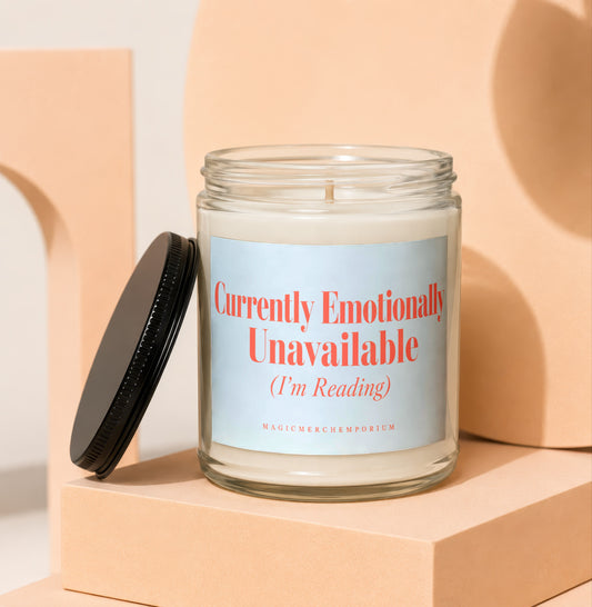 Glass candle with lid off, label reads "Currently Emotionally Unavailable (I'm Reading)".