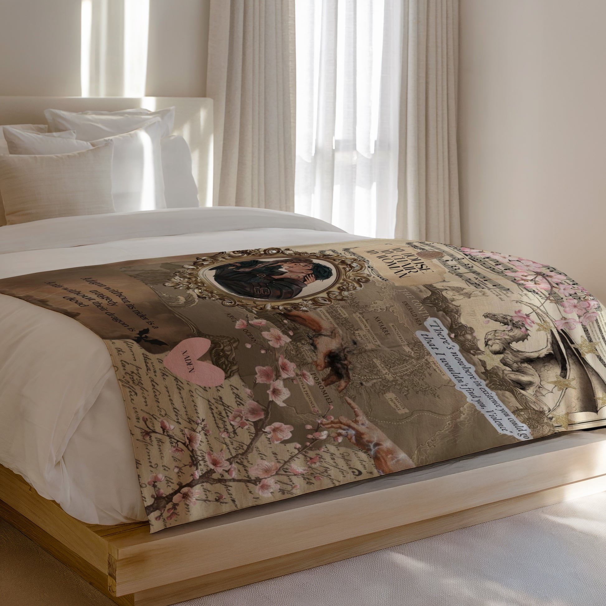Tapestry with romantic drawing, dragon, flowers, and text on a bed.