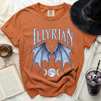 Orange t-shirt with "ILLYRIAN" text, dragon wings, and moon phases.