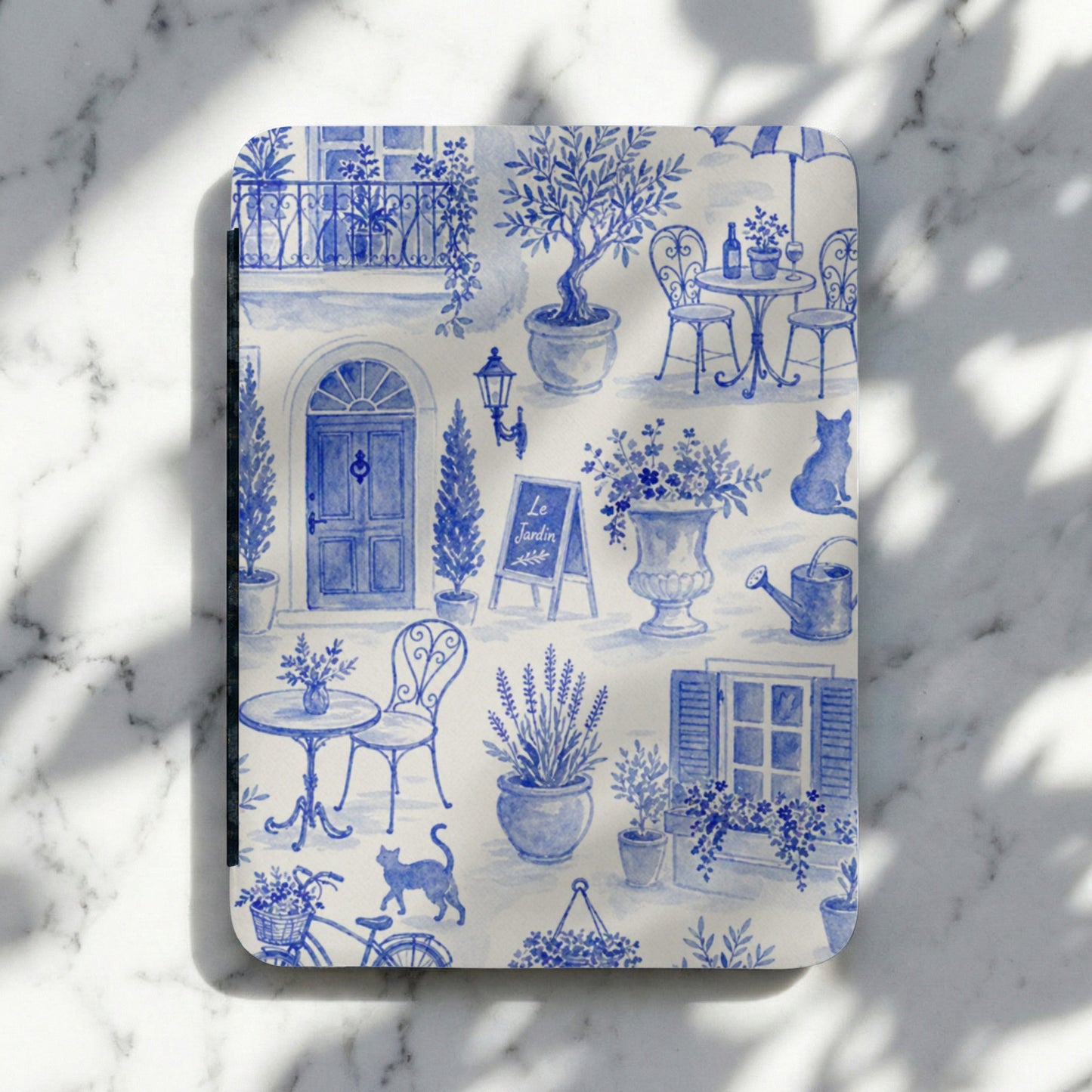 Blue toile notebook with French garden scene, café tables, and cats.