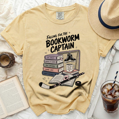 T-shirt with hockey goalie net and books, "Falling for the Bookworm Captain" text.